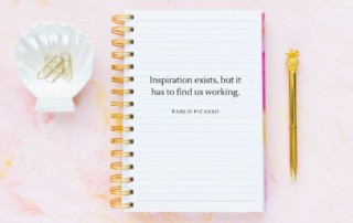 pink table with notebook open and a gold pen and shell bowl filled with paper clips, how to use a writer's notebook