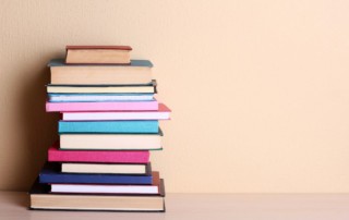 stack of books; how to market your first book