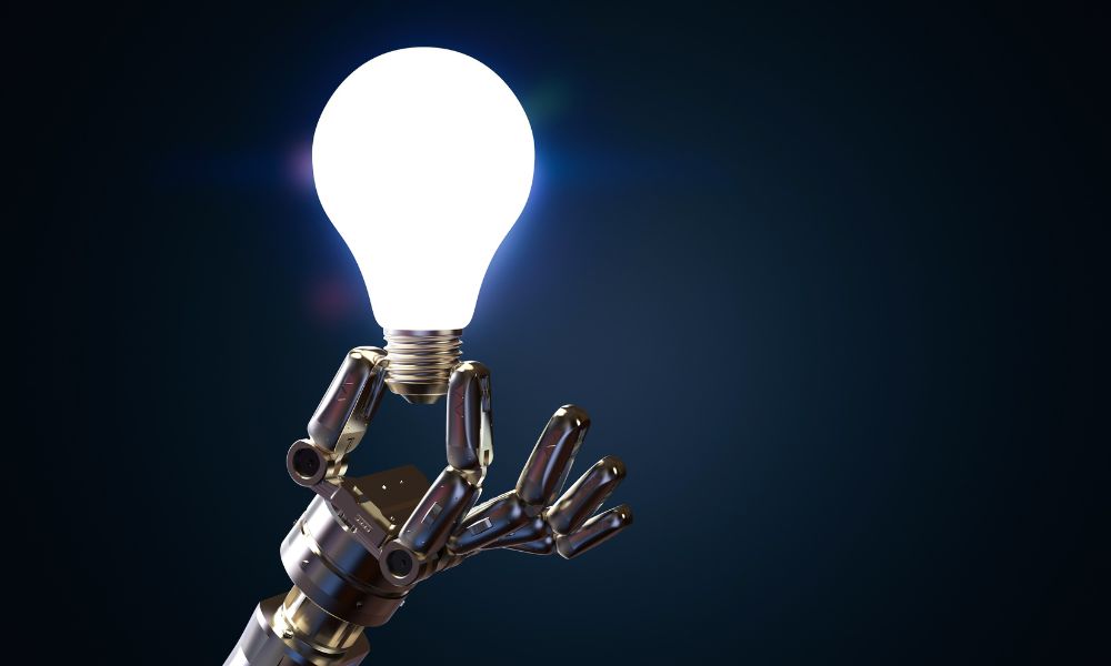 robot hand holding a lightbulb; AI-Powered Writing Assistants